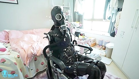 Latex 014 Rubber Girl Wheelchair